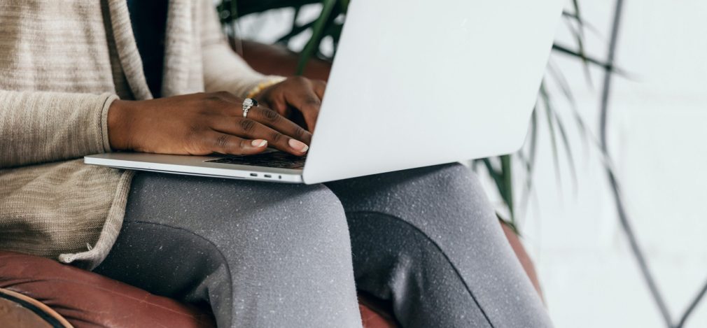 sat-on-leather-chair-using-laptop